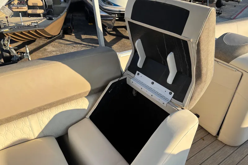 Slide: The Image of 2022 Avalon Catalina 2585 VRB boat seat with open storage compartment. - 59