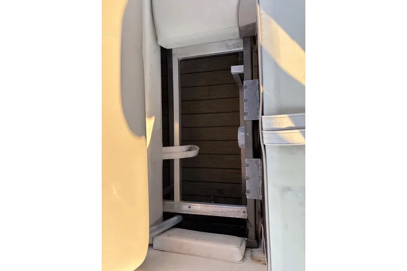 Slide: The Image of 2022 Avalon Catalina 2585 VRB boat interior with seating and storage compartment. - 61