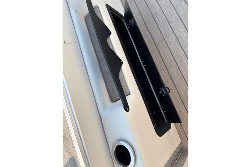 Slide: The Image of 2022 Avalon Catalina 2585 VRB boat interior with open storage compartment. - 62