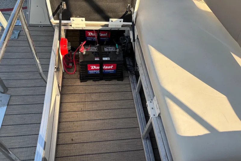 Slide: The Image of Battery compartment of 2022 Avalon Catalina 2585 VRB boat with Duralast marine battery. - 63