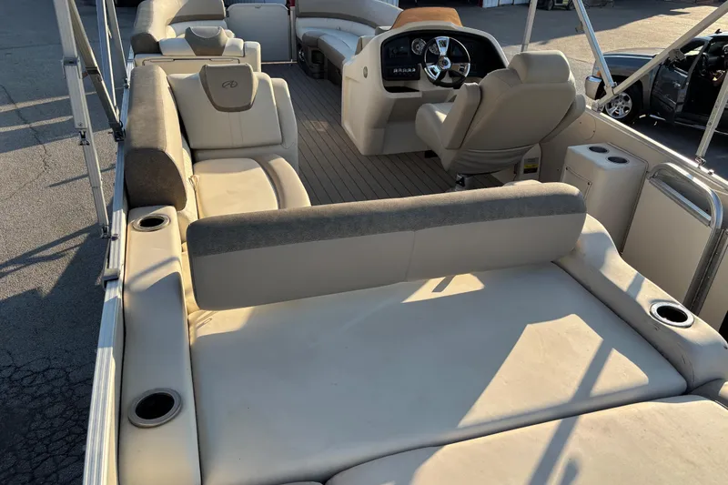 Slide: The Image of 2022 Avalon Catalina 2585 VRB pontoon boat interior with plush seating and modern helm. - 67