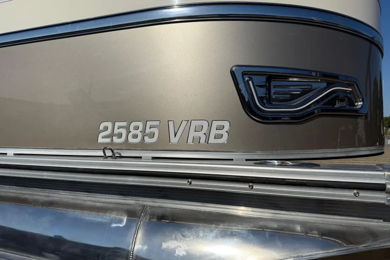 Slide: The Image of 2022 Avalon Catalina 2585 VRB pontoon boat on trailer by the water. - 71