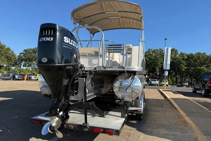 Slide: The Image of 2022 Avalon Catalina 2585 VRB pontoon boat with Suzuki outboard motor on trailer. - 77
