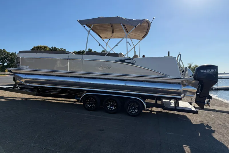 Slide: The Image of 2022 Avalon Catalina 2585 VRB pontoon boat with Suzuki outboard motor on trailer. - 87