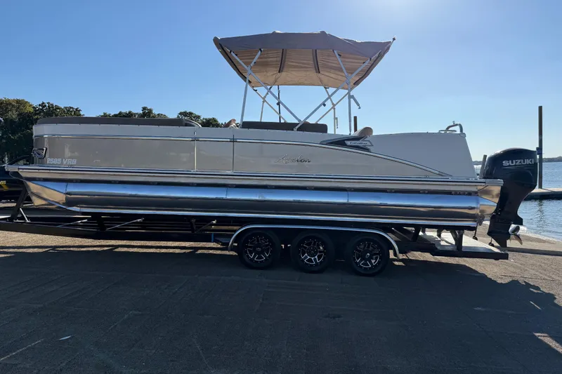 Slide: The Image of 2022 Avalon Catalina 2585 VRB pontoon boat on trailer with Suzuki outboard motor. - 88