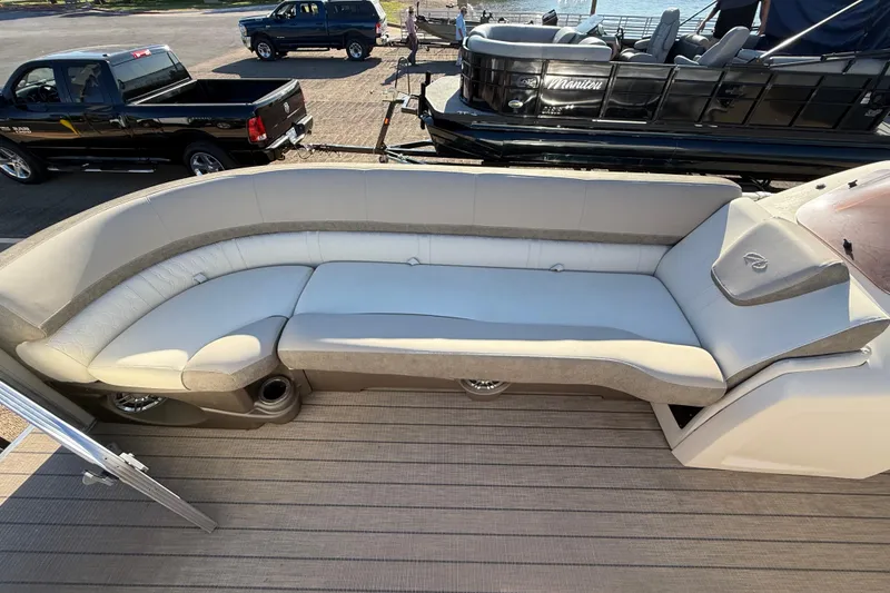 Slide: The Image of 2022 Avalon Catalina 2585 VRB pontoon boat with spacious seating and canopy on a lake. - 95