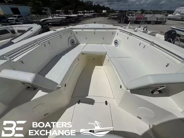 Slide: The Image of 2026 Cobia 320 Center Console with spacious deck and seating area. - 10