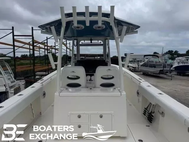 Slide: The Image of 2026 Cobia 320 Center Console at a boatyard. - 5