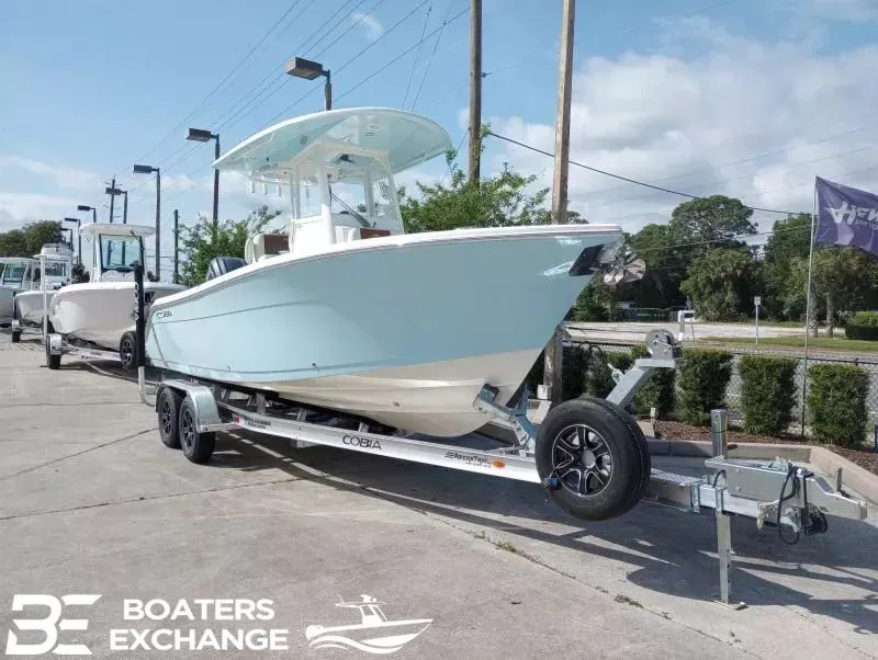 Slide: The Image of 2022 Cobia 240 Center Console on trailer at Boaters Exchange. - 2