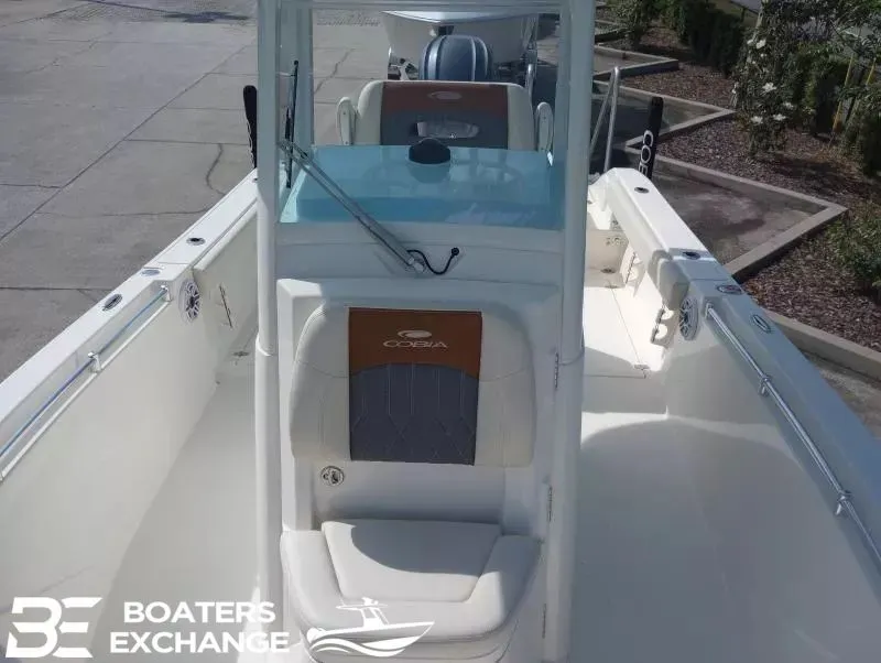 Slide: The Image of Cobia 240 Center Console boat, 2022 model, front view at dock. - 6