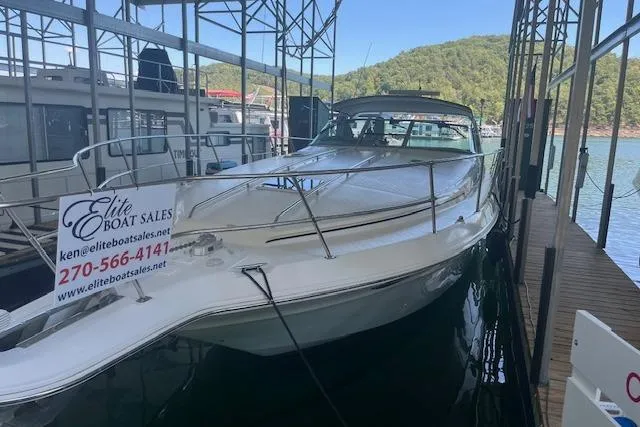 The Image of 1998 Sea Ray 400 Express Cruiser docked, available at Elite Boat Sales. - 0
