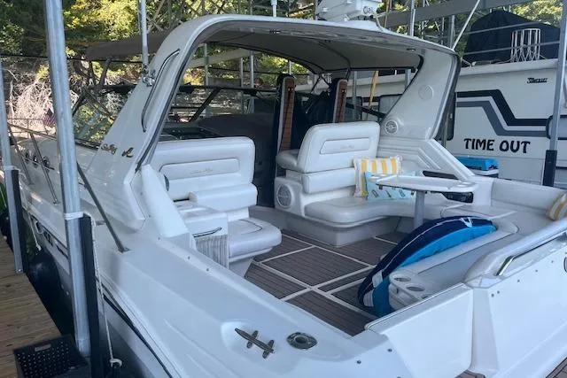Slide: The Image of 1998 Sea Ray 400 Express Cruiser with spacious seating and elegant design. - 2