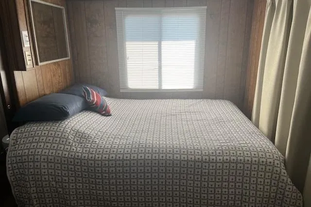 Slide: The Image of Cozy bedroom in 1985 Jamestowner 16 x 63 houseboat with window and patterned bedding. - 20