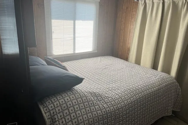 Slide: The Image of Cozy bedroom in 1985 Jamestowner 16 x 63 houseboat with window and curtains. - 22