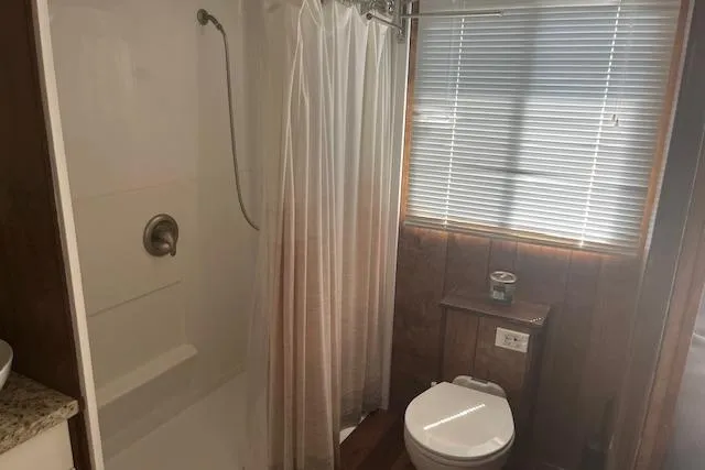 Slide: The Image of Bathroom interior of 1985 Jamestowner 16 x 63 houseboat with shower and toilet. - 24