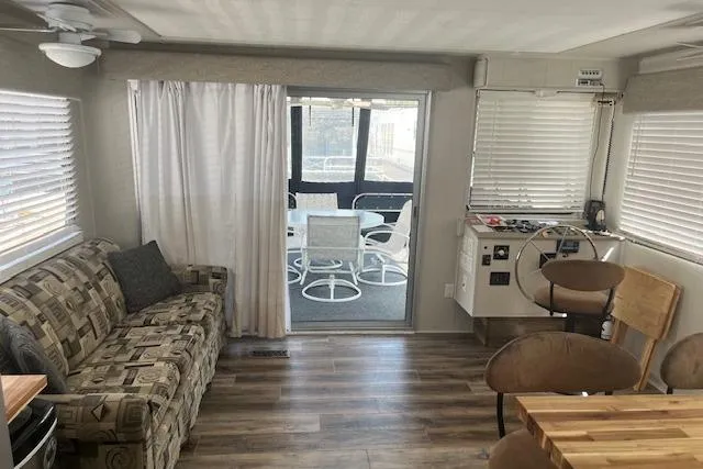 Slide: The Image of Interior of 1985 Jamestowner 16 x 63 houseboat with modern furnishings and wood flooring. - 8