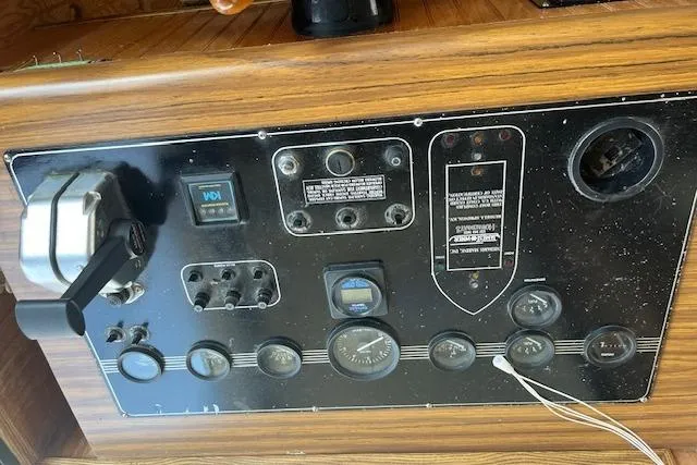 Slide: The Image of Control panel of a 1992 Jamestowner 16x72 houseboat with various gauges and switches. - 4