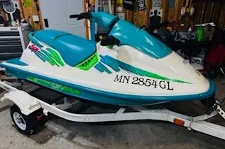 The Image of 1994 Sea-Doo SPX jet ski on trailer in garage setting. - 1