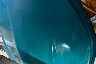 Slide: The Image of 1994 Sea-Doo SPX jet ski, teal color, close-up view. - 11