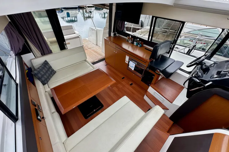 Slide: The Image of Interior of 2015 Jeanneau NC11 yacht with elegant seating and helm station. - 24
