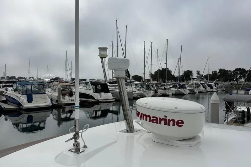 Slide: The Image of Jeanneau NC11 2015 yacht with Raymarine equipment docked in a marina. - 26