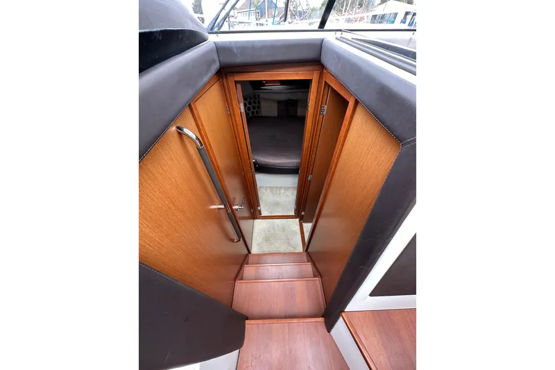Slide: The Image of Stairway leading to cabin interior of 2015 Jeanneau NC11 boat. - 46