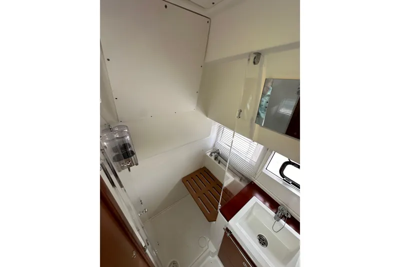 Slide: The Image of Bathroom interior of 2015 Jeanneau NC11 yacht with sink and shower area. - 48