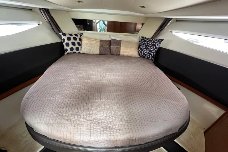 Slide: The Image of Cozy cabin interior of 2015 Jeanneau NC11 with stylish bedding and pillows. - 58