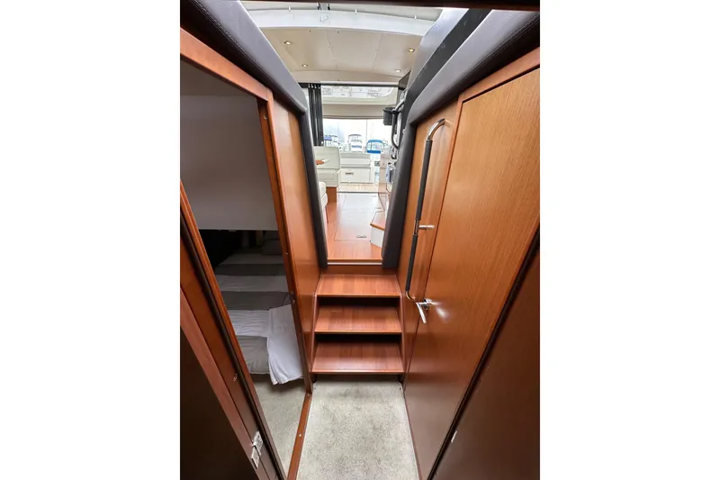 Slide: The Image of Interior view of 2015 Jeanneau NC11 yacht, featuring wooden stairs and modern design. - 63