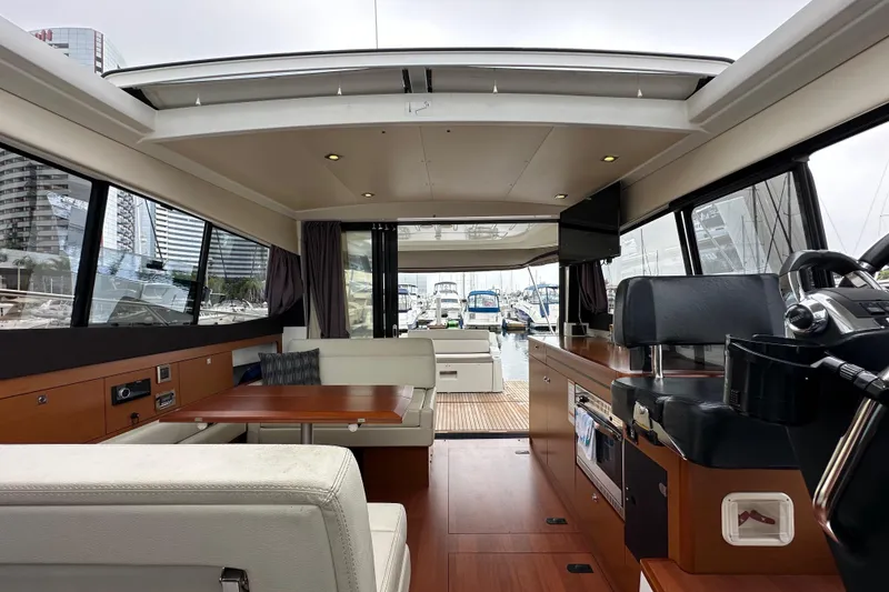 Slide: The Image of Interior of 2015 Jeanneau NC11 yacht with modern design and spacious seating area. - 64