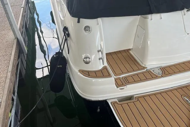 Slide: The Image of 2005 Sea Ray 320 Sundancer boat with teak deck, docked in marina. - 25
