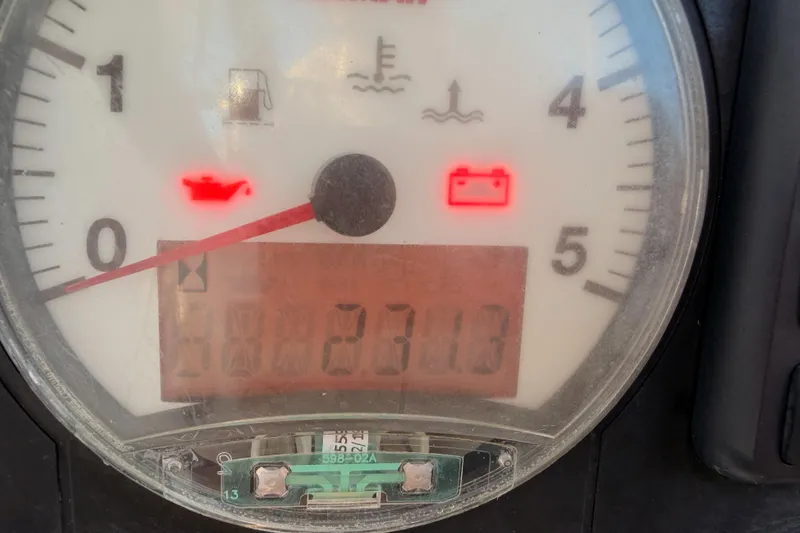 Slide: The Image of Close-up of Beneteau Oceanis 30.1 gauge panel showing warning lights and odometer reading. - 10