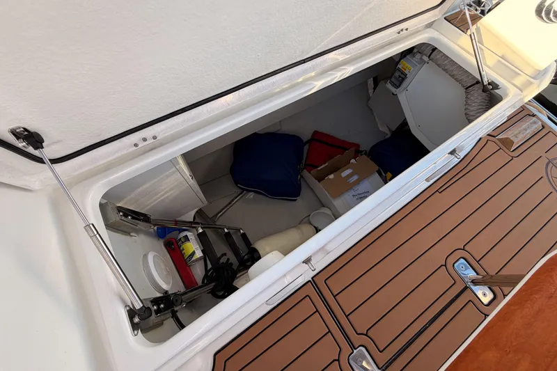Slide: The Image of Storage compartment of a 2020 Beneteau Oceanis 30.1 sailboat, featuring various equipment. - 23