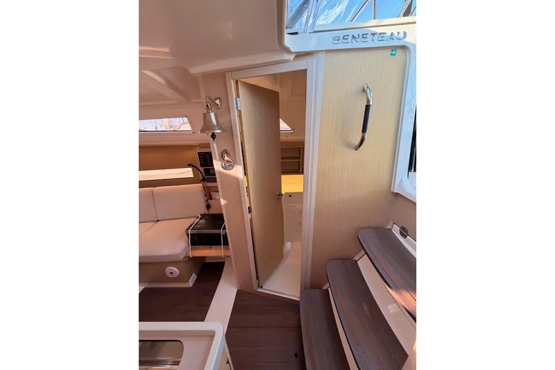 Slide: The Image of Interior of 2020 Beneteau Oceanis 30.1 yacht, featuring modern design and cozy seating area. - 30