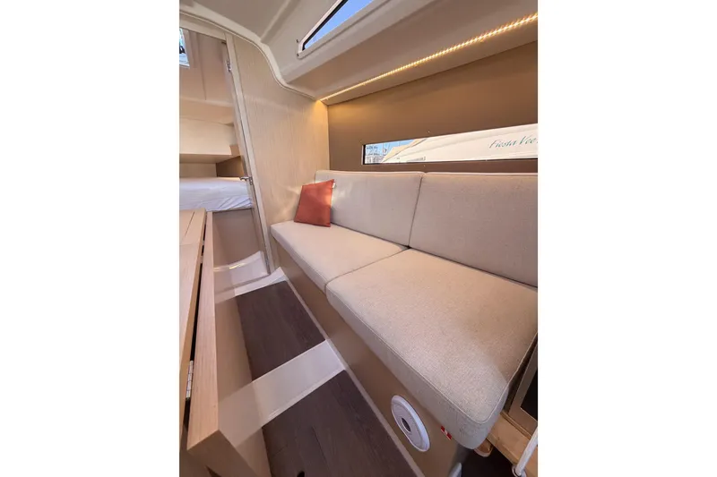 Slide: The Image of Interior of 2020 Beneteau Oceanis 30.1 yacht with beige sofa and modern design. - 37