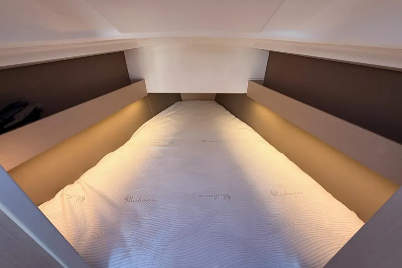 Slide: The Image of Cozy cabin interior of 2020 Beneteau Oceanis 30.1 yacht with soft lighting. - 41