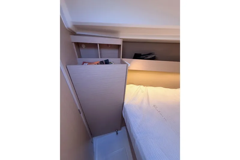 Slide: The Image of Interior cabin of 2020 Beneteau Oceanis 30.1 yacht with storage and bed. - 42