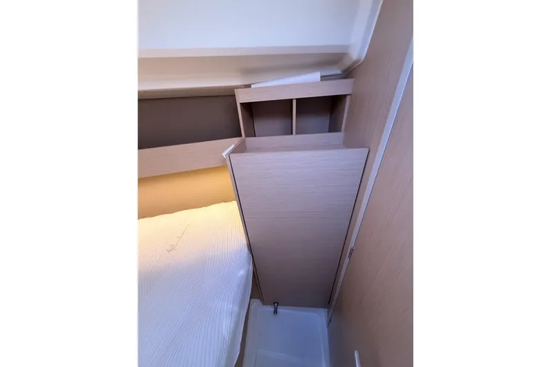 Slide: The Image of Interior cabin of 2020 Beneteau Oceanis 30.1 yacht, featuring a compact, modern design. - 43