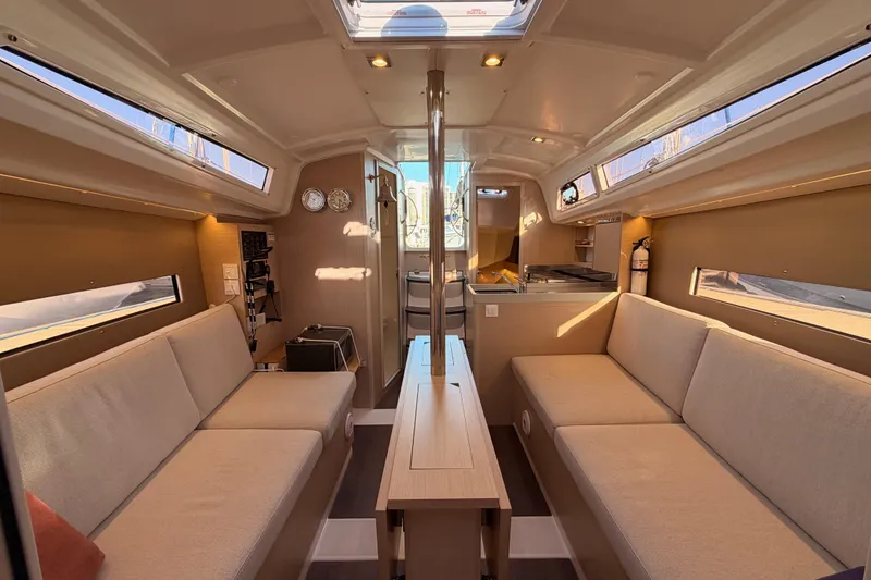 Slide: The Image of Interior of 2020 Beneteau Oceanis 30.1 sailboat, featuring cozy seating and modern design. - 44