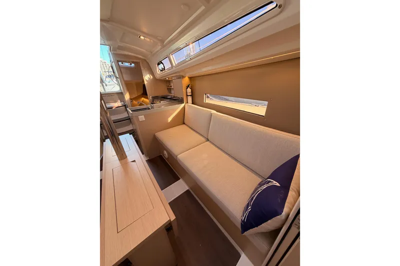 Slide: The Image of Interior of 2020 Beneteau Oceanis 30.1 yacht with cozy seating and modern kitchen. - 46