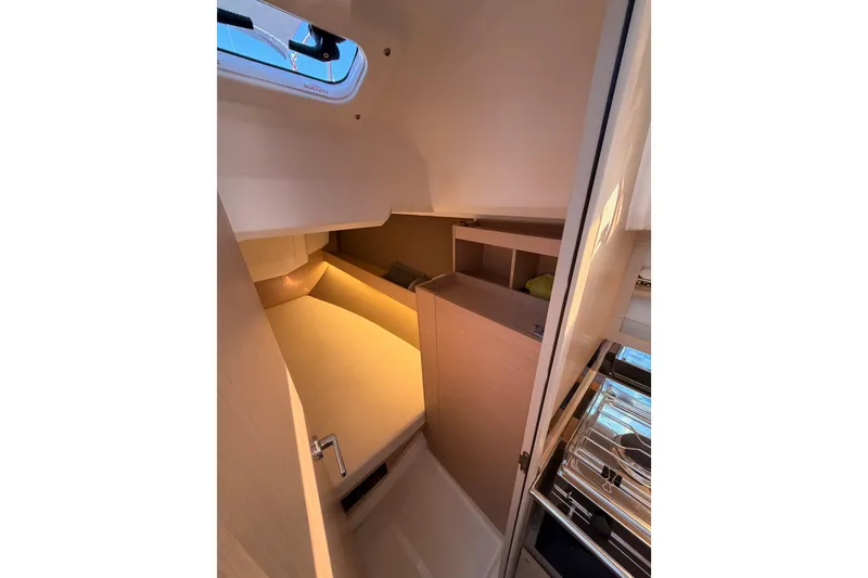 Slide: The Image of Interior cabin of 2020 Beneteau Oceanis 30.1 yacht, featuring cozy sleeping area. - 48