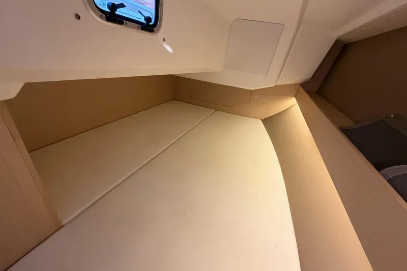 Slide: The Image of Interior cabin of 2020 Beneteau Oceanis 30.1 sailboat, featuring a cozy sleeping area. - 49