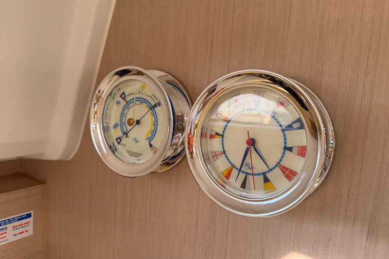 Slide: The Image of Nautical instruments on Beneteau Oceanis 30.1 yacht, 2020 model, featuring a clock and barometer. - 55