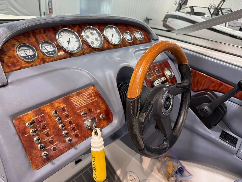 Slide: The Image of Dashboard of a 2003 Cobalt 262 boat with wood trim. - 20