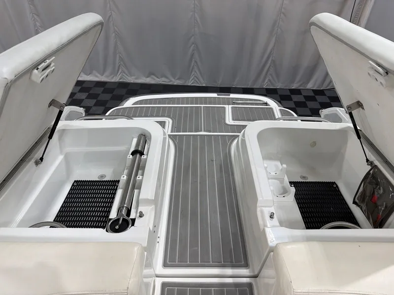 Slide: The Image of Open storage compartments on a 2003 Cobalt 262 boat. - 21