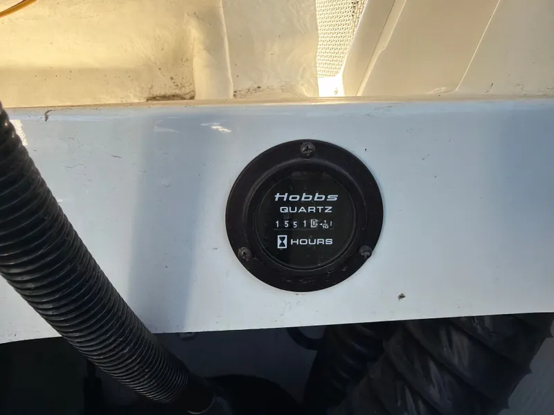 Slide: The Image of Hobbs hour meter on a 2003 Cobalt 262 boat. - 23