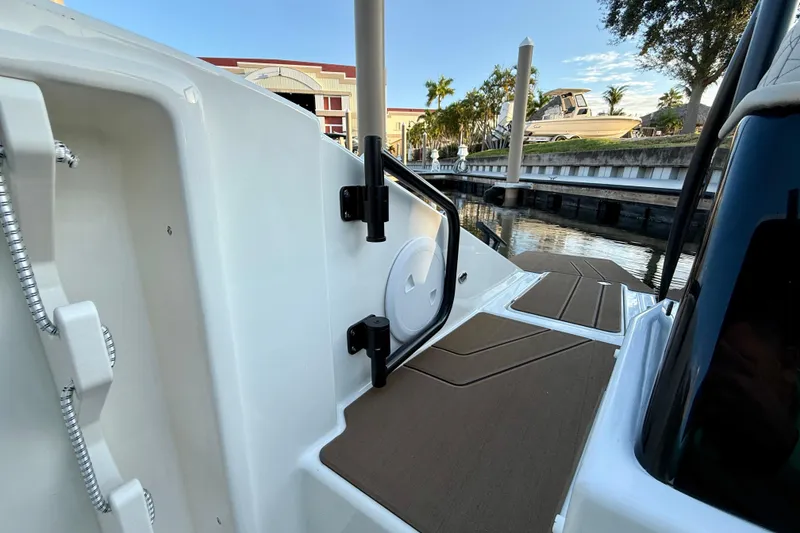 Slide: The Image of 2026 Navan S30 boat docked, showcasing deck and water view. - 13