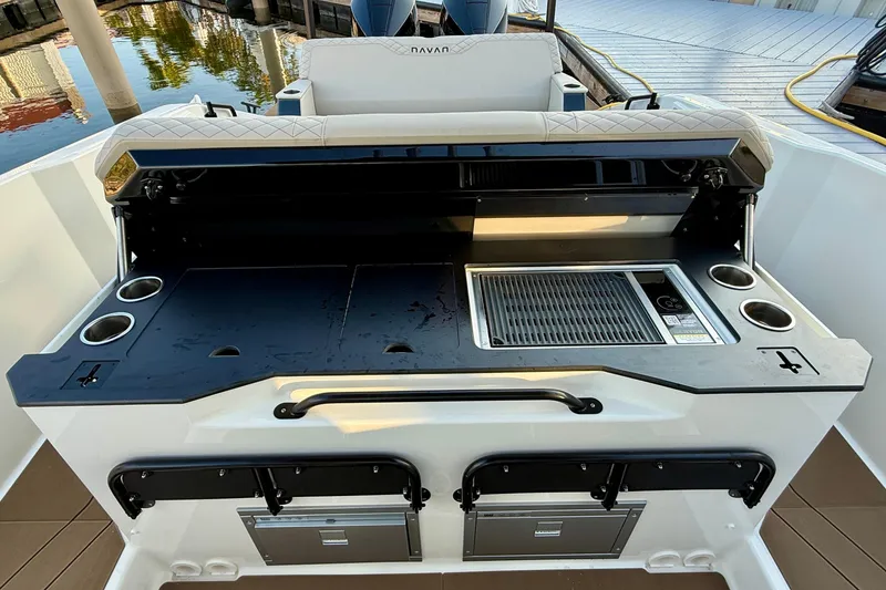 Slide: The Image of Outdoor kitchen on 2026 Navan S30 boat with grill and cup holders. - 19