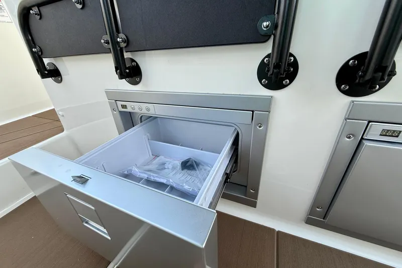 Slide: The Image of Navan S30 2026 boat interior with open storage compartment and modern design. - 20