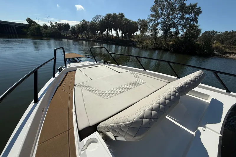 Slide: The Image of Navan S30 2026 boat with luxurious seating on a serene lake. - 26